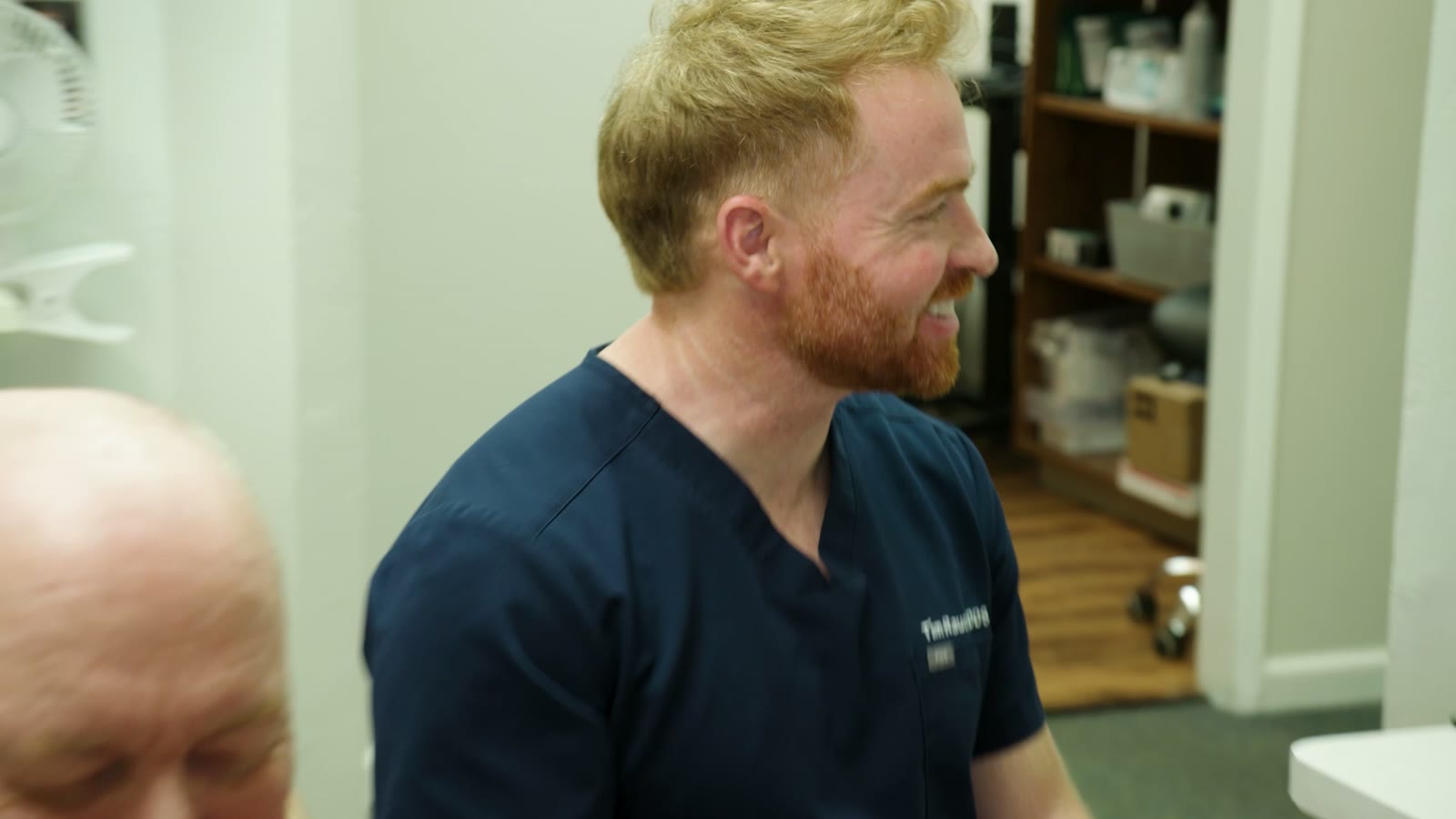 Dr. Rauch laughing with a patient in the consult room — Hollister, CA