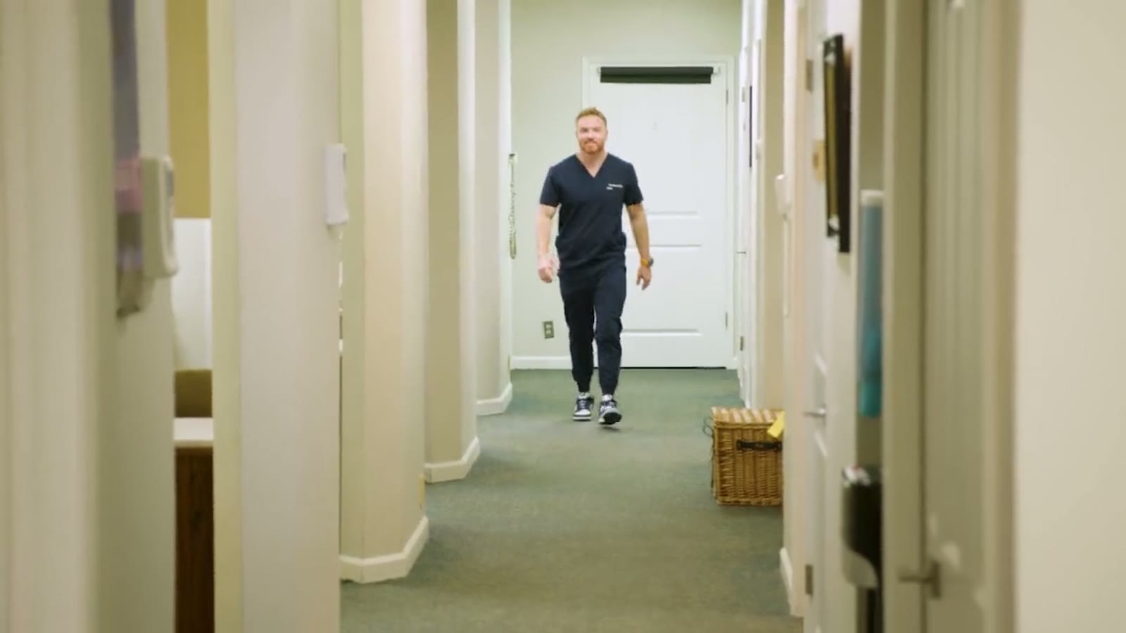 Dr. Rauch walking through the practice hallway