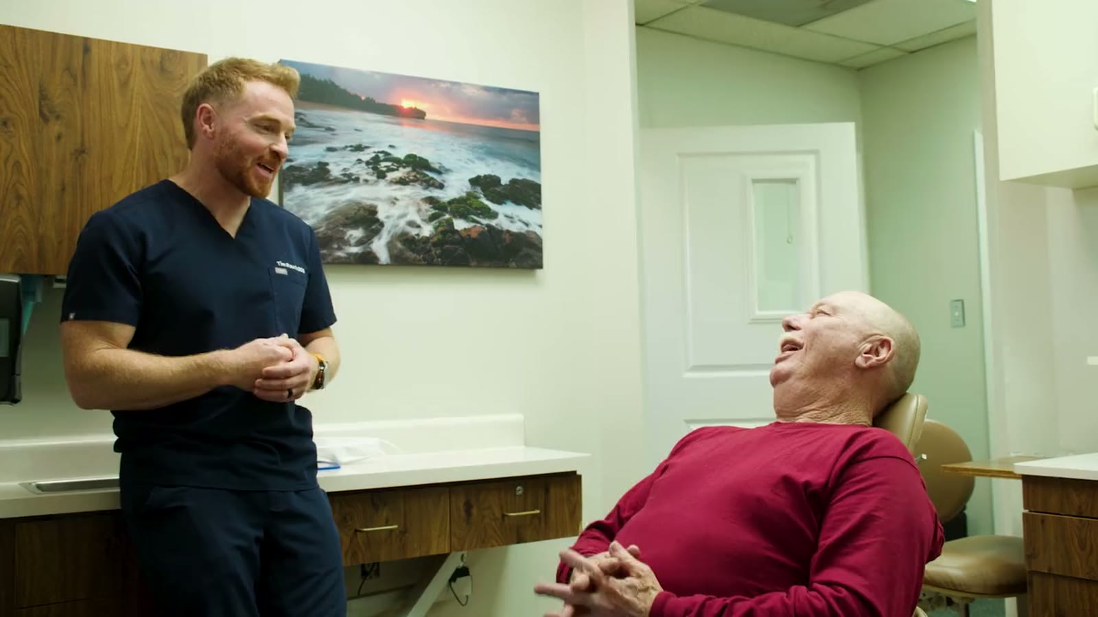 Dr. Rauch talking with a patient in the consult room
